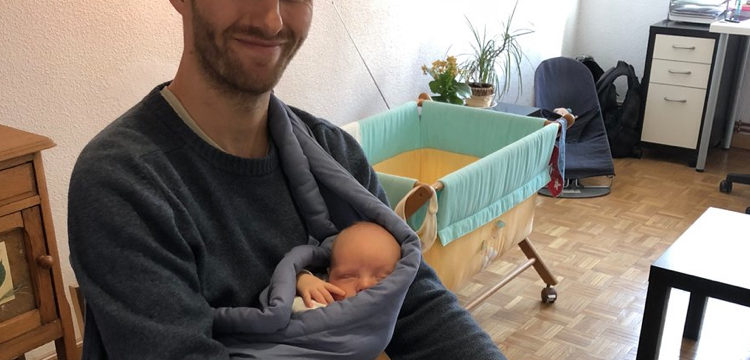 Michael Working While taking care of Baby